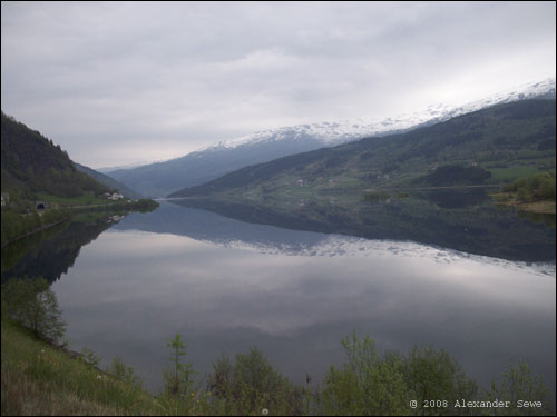 Mountain and sky reflected in lake