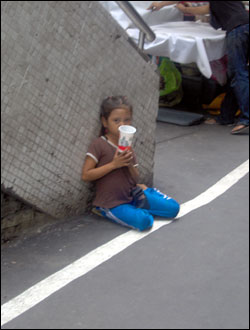 Little girl begging for money in the streets of Bangkok